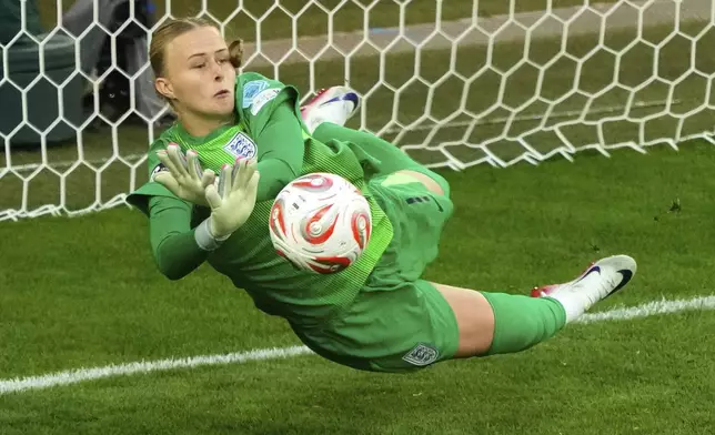 FILE - England goalkeeper Hannah Hampton stops a shot from Spain's Aitana Bonmati during a penalty shootout at the end of the Women's Euro 2025 final soccer match between England and Spain at St. Jakob-Park in Basel, Switzerland, Sunday, July 27, 2025. (AP Photo/Michael Probst, File)