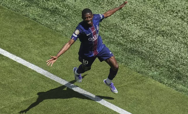 FILE - Paris Saint-Germain's Ousmane Dembele celebrates after scoring during the Club World Cup semifinal soccer match between PSG and Real Madrid in East Rutherford, N.J., Wednesday, July 9, 2025. (AP Photo/Pamela Smith, File)