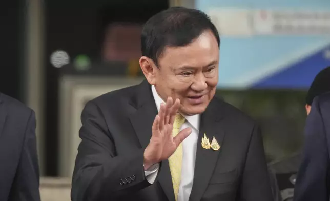 Former Thai Prime Minister Thaksin Shinawatra leaves after a court acquitted Thaksin of royal defamation at Criminal Court in Bangkok, Thailand, Friday, Aug. 22, 2025. (AP Photo/Sakchai Lalit)