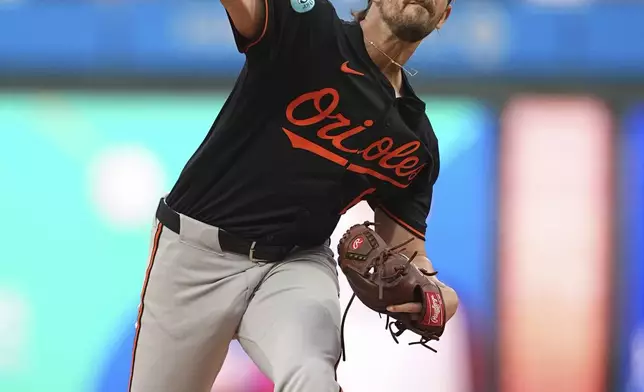 Baltimore Orioles' Dean Kremer pitches during the first inning of a baseball game against the Philadelphia Phillies, Tuesday, Aug. 5, 2025, in Philadelphia. (AP Photo/Matt Rourke)