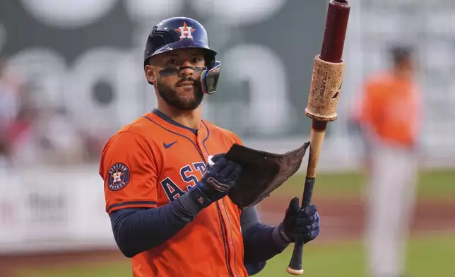 Houston Astros designated hitter Carlos Correa prepares to hit during the first inning of a baseball game against the Boston Red Sox at Fenway Park, Friday, Aug. 1, 2025, in Boston. (AP Photo/Charles Krupa)