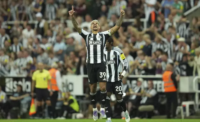 Newcastle's Bruno Guimaraes celebrates after scoring during the Premier League soccer match between Newcastle and Liverpool in Newcastle, England, Monday, Aug. 25, 2025. (AP Photo/Jon Super)