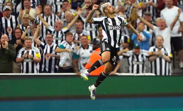 Newcastle United's Bruno Guimaraes celebrates scoring during the English Premier League soccer match between Liverpool and Newcastle United at St James' Park, Newcastle, England, Monday Aug. 25, 2025. (Owen Humphreys/PA via AP)