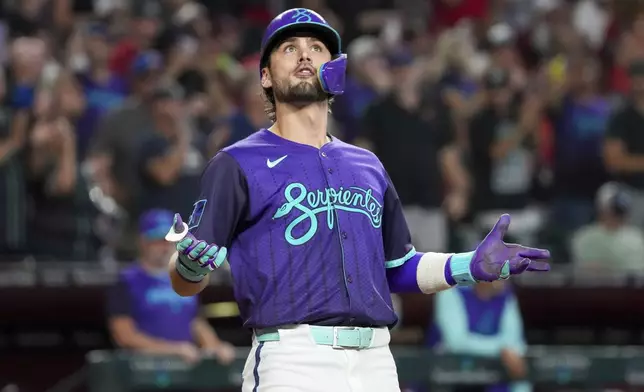 Arizona Diamondbacks' Blaze Alexander celebrates after hitting a solo home run against the Cincinnati Reds during the fifth inning of a baseball game Saturday, Aug. 23, 2025, in Phoenix. (AP Photo/Darryl Webb)