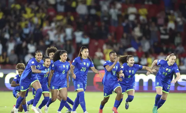 Brazilian players celebrate after winning the Women's Copa America final soccer match against Colombia in a penalty shootout at Rodrigo Paz Delgado stadium in Quito, Ecuador, Saturday, Aug. 2, 2025. (AP Photo/Patricio Teran)