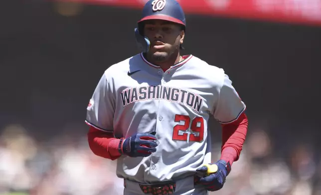 Washington Nationals' James Wood jogs around the bases after hitting a solo home run during the first inning of a baseball game against the San Francisco Giants, Saturday, Aug. 9, 2025, in West Sacramento, Calif. (AP Photo/Scott Marshall)