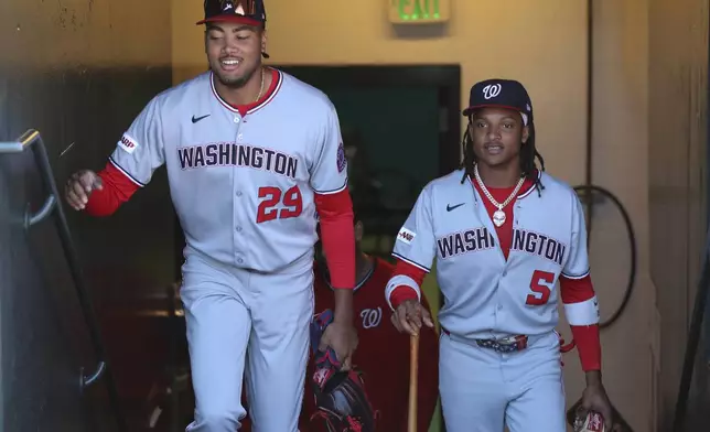 Washington Nationals' James Wood (29) and CJ Abrams (5) walk up the tunnel before a baseball game against the San Francisco Giants, Saturday, Aug. 9, 2025, in West Sacramento, Calif. (AP Photo/Scott Marshall)