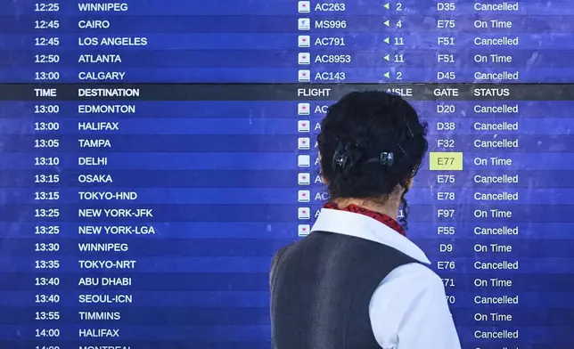 Air Canada flights show as cancelled at Pearson International Airport as flight attendants go on strike in Toronto on Saturday, Aug. 16, 2025. (Sammy Kogan/The Canadian Press via AP)