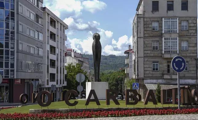 A statue of an octopus is displayed on Wednesday, June 25, 2025, in O Carballino, Spain. (AP Photo/Annika Hammerschlag)