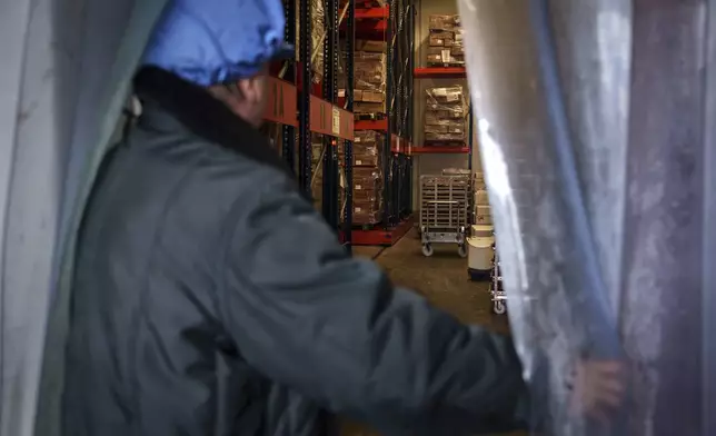 Frozen octopuses imported from Morocco and Mauritania are stored at Frigorificos Arcos SL on Wednesday, June 25, 2025, in O Carballino, Spain. (AP Photo/Annika Hammerschlag)