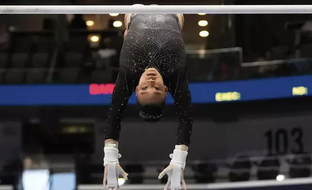 Leanne Wong of the University of Florida competes on the uneven bars during the senior women's finals of the U.S. Gymnastics Championships in New Orleans, Sunday, Aug. 10, 2025. (AP Photo/Gerald Herbert)