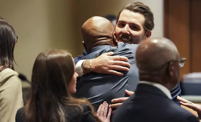 Hernandez Govan, accused of orchestrating the killing of rapper Young Dolph, hugs a member of his defense team in the courtroom after being acquitted on all charges Thursday, Aug. 21, 2025 in Memphis, Tenn. (Chris Day/Commercial Appeal/USA Today Network via Pool)