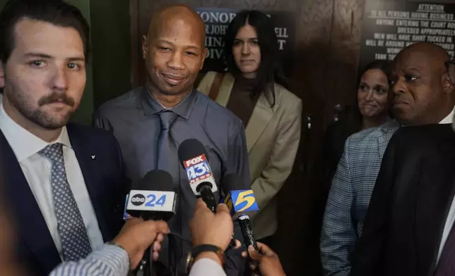 Hernandez Govan, second from left, who was accused of orchestrating the killing of rapper Young Dolph, speaks during a news conference after being acquitted on all charges in his trial, Thursday, Aug. 21, 2025, in Memphis, Tenn. (AP Photo/George Walker IV)
