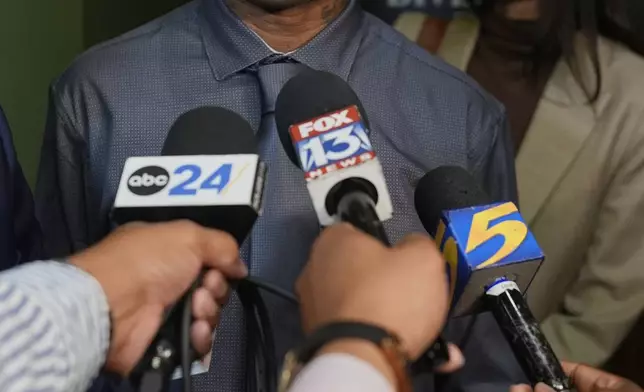 Hernandez Govan, who was accused of orchestrating the killing of rapper Young Dolph, speaks during a news conference after being acquitted on all charges in his trial, Thursday, Aug. 21, 2025, in Memphis, Tenn. (AP Photo/George Walker IV)