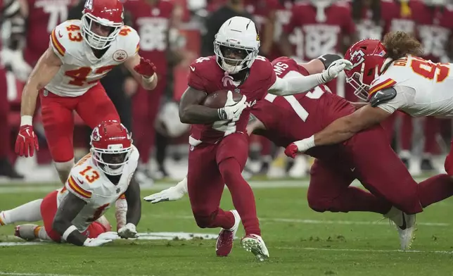 Arizona Cardinals wide receiver Greg Dortch (4) runs the ball against the Kansas City Chiefs during the first half of an NFL preseason football game, Saturday, Aug. 9, 2025, in Glendale. (AP Photo/Rick Scuteri)