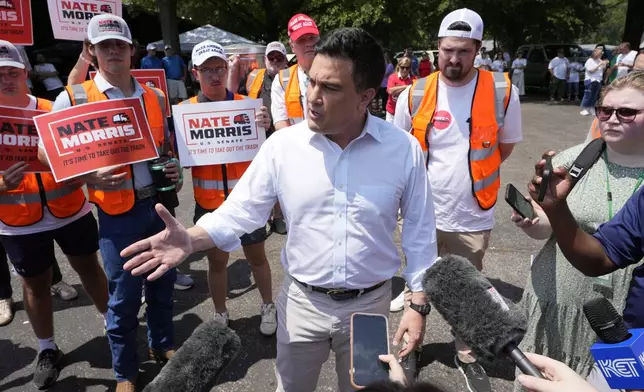 Tech entrepreneur Nate Morris, a candidate for United States Senate, talks with reporters at the annual Fancy Farm picnic Saturday, Aug. 2, 2025, in Fancy Farm, Ky. (AP Photo/Mark Humphrey)