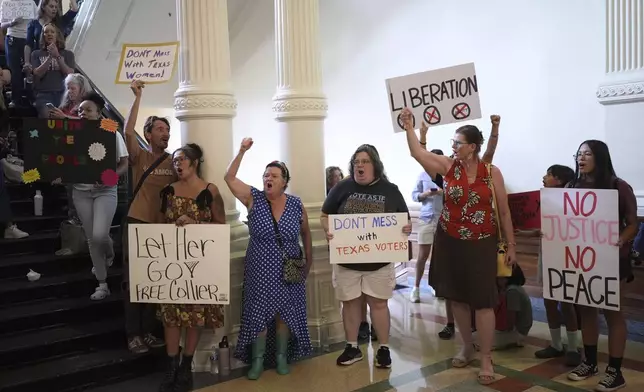 Protesters gather outside of the House Chamber where Democratic Texas state Rep. Nicole Collier refuses to leave due to a required law enforcement escort, Tuesday, Aug. 19, 2025, in Austin, Texas. (AP Photo/Eric Gay)
