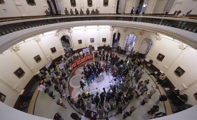 Democratic lawmakers talk to the media and supporters after House Republicans approved a redrawn U.S. congressional map in Texas during a special session, Wednesday, Aug. 20, 2025, in Austin, Texas. (AP Photo/Eric Gay)