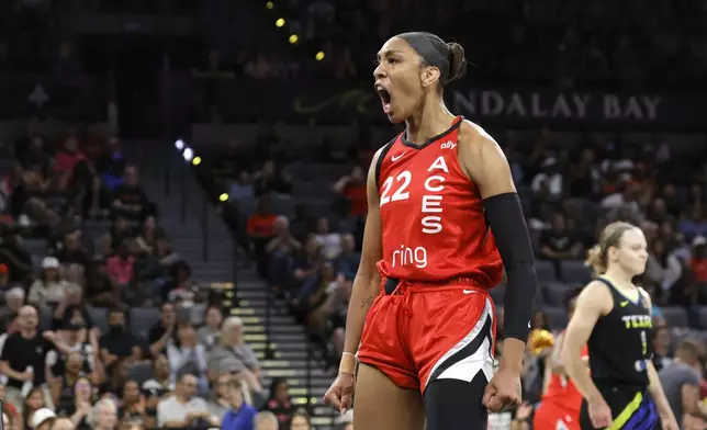 Las Vegas Aces center A'ja Wilson (22) reacts after making a basket against the Dallas Wings during the first half of a WNBA basketball game Sunday, Aug. 17, 2025, in Las Vegas. (Steve Marcus/Las Vegas Sun via AP)