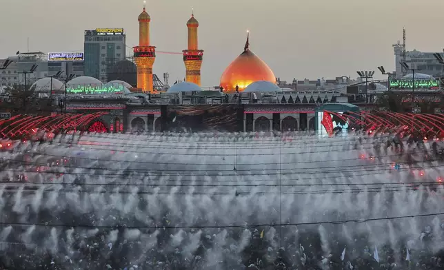 Shiite pilgrims participate in Arbaeen, which marks the end of the 40-day mourning period following Ashoura, in Karbala, Iraq, Thursday, Aug. 14, 2025. (AP Photo/Anmar Khalil)
