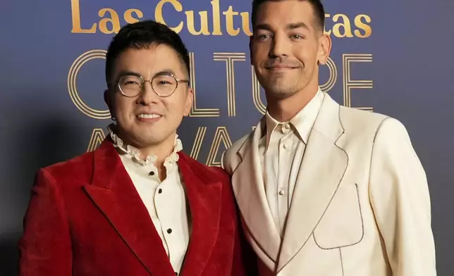 FILE - Co-hosts Bowen Yang, left, and Matt Rogers pose together at Las Culturistas Culture Awards on Thursday, July 17, 2025, at The Orpheum Theatre in Los Angeles. (AP Photo/Chris Pizzello, File)
