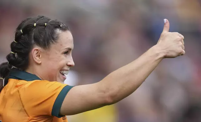 Desiree Miller of Australia celebrates during the group A match at the 2025 Women's Rugby World Cup between Australia and Samoa in Manchester, England, Saturday, Aug. 23, 2025. (AP Photo/Dave Shopland)