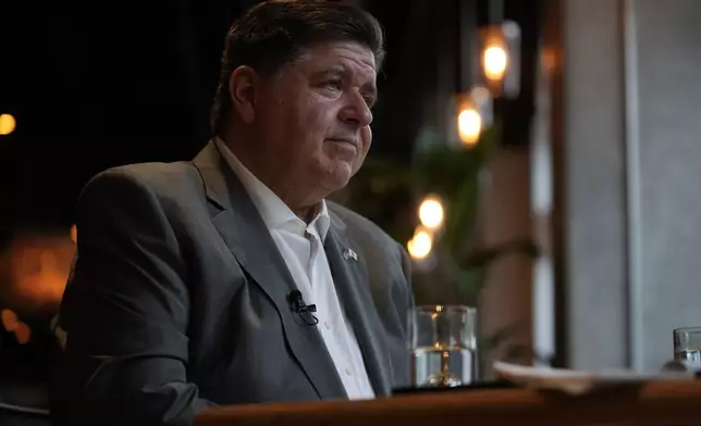 Illinois Gov. J.B. Pritzker sits for an interview with the Associated Press, Wednesday, Aug. 27, 2025, in the Bronzeville neighborhood of Chicago. (AP Photo/Erin Hooley)