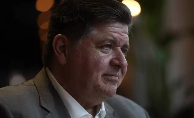 Illinois Gov. J.B. Pritzker sits for an interview with the Associated Press, Wednesday, Aug. 27, 2025, in the Bronzeville neighborhood of Chicago. (AP Photo/Erin Hooley)