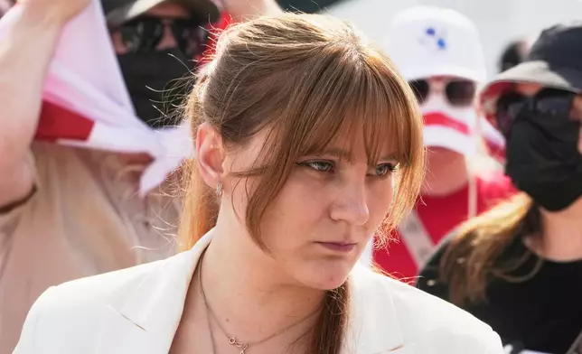 Antanina Kanavalava, center, a former political prisoner in Belarus, takes part in the Freedom March for Belarus in Warsaw, Poland, on Saturday, Aug. 9, 2025. (AP Photo/Czarek Sokolowski)