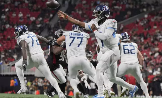 Tennessee Titans quarterback Cameron Ward (1) throws a pass during the first half of a preseason NFL football game against the Atlanta Falcons, Friday, Aug. 15, 2025, in Atlanta. (AP Photo/Mike Stewart)
