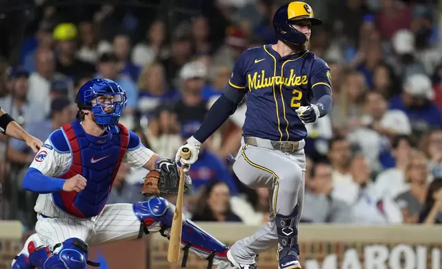 Milwaukee Brewers' Brice Turang (2) hits a one-run single during the sixth inning of a baseball game against the Chicago Cubs, Wednesday, Aug. 20, 2025, in Chicago. (AP Photo/Erin Hooley)