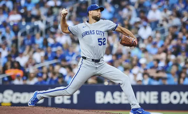 Kansas City Royals pitcher Michael Wacha throws against the Toronto Blue Jays during first-inning baseball game action in Toronto, Friday, Aug. 1, 2025. (Sammy Kogan/The Canadian Press via AP)