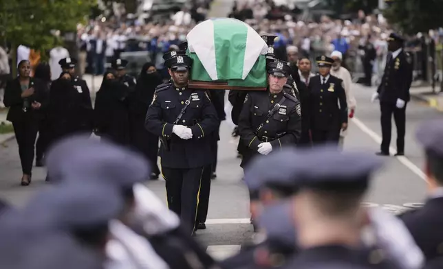 Pallbearers with the NYPD Ceremonial Unit carry the casket of officer Didarul Islam during his funeral, Thursday, July 31, 2025, in New York. (AP Photo/Angelina Katsanis)
