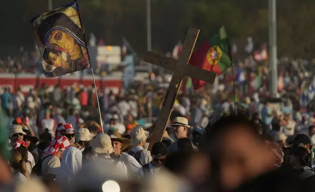 Young people attend for the prayer vigil with Pope Leo XIV in the Youths Jubilee at the Tor Vergata field in Rome, Saturday, Aug. 2, 2025. (AP Photo/Gregorio Borgia)