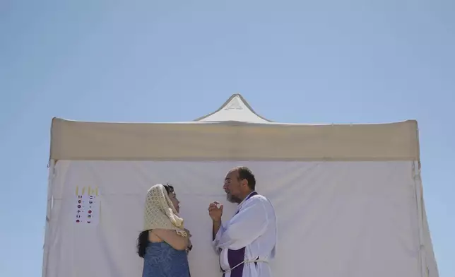 Young people participate in the Youth Jubilee can celebrate the penitential day and confess themselves in the confessionals set up for them in the Circus Maximus in Rome, Friday, Aug. 1, 2025. (AP Photo/Andrew Medichini)