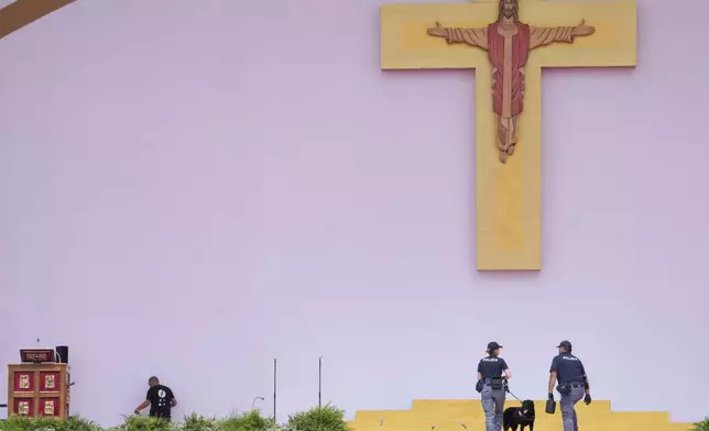 Italian Police officers patrol in the Youths Jubilee at the Tor Vergata field in Rome, Saturday, Aug. 2, 2025. (AP Photo/Gregorio Borgia)