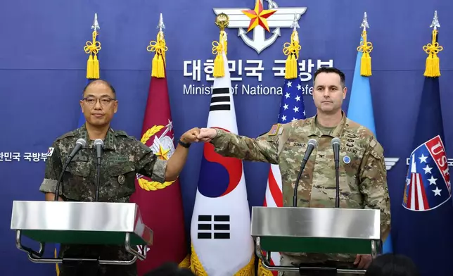 Col. Lee Sung-jun, left, public affairs director of South Korea's Joint Chiefs of Staff and Col. Ryan Donald, public affairs director of the United Nations Command (UNC), Combined Forces Command (CFC), and United States Forces Korea (USFK) attend a press briefing of Ulchi Freedom Shield 2025 exercise at the Defense Ministry in Seoul Thursday, Aug. 7, 2025. (Chung Sung-Jun/Pool Photo via AP)
