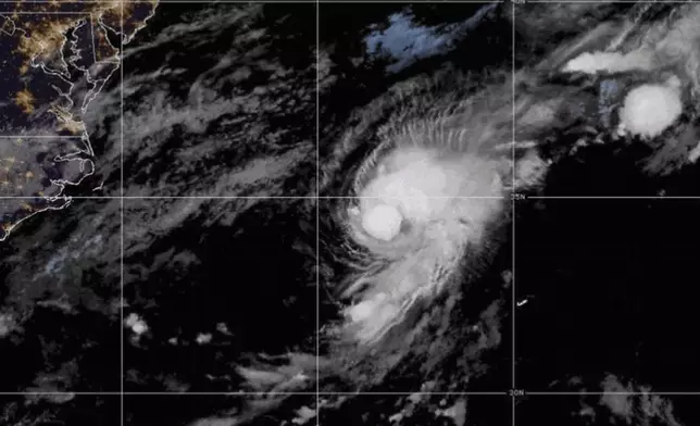 This satellite photo provided by NOAA shows Tropical Storm Dexter in the western Atlantic on Monday, Aug. 4, 2025. (NOAA via AP)