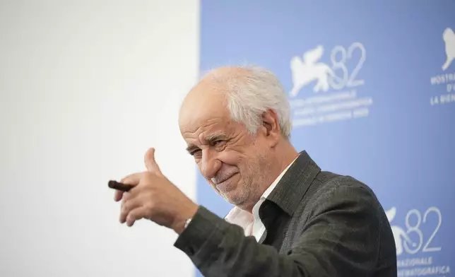 Toni Servillo poses for photographers at the photo call for the film 'La Grazia' during the 82nd edition of the Venice Film Festival in Venice, Italy, on Wednesday, Aug. 27, 2025. (Photo by Alessandra Tarantino/Invision/AP)