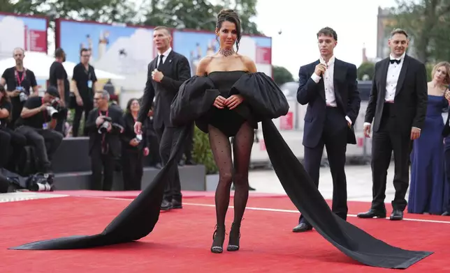 Alessandra De Tomaso poses for photographers on the red carpet for the film 'After the Hunt' during the 82nd edition of the Venice Film Festival in Venice, Italy, on Friday, Aug. 29, 2025. (Photo by Scott A Garfitt/Invision/AP)