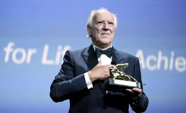Werner Herzog accepts the Golden Lion for lifetime achievement during the opening ceremony and the premiere of the film 'La Grazia' during the 82nd edition of the Venice Film Festival in Venice, Italy, on Wednesday, Aug. 27, 2025. (Photo by Scott A Garfitt/Invision/AP)