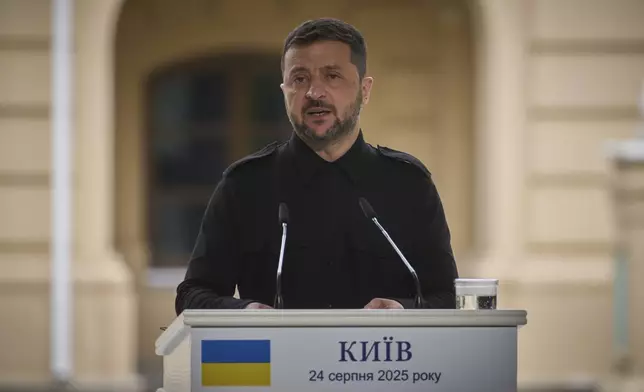 Ukrainian President Volodymyr Zelenskyy talks during the press conference with Canadian Prime Minister Mark Carney in Kyiv, Ukraine, Sunday, Aug. 24, 2025. (AP Photo/Efrem Lukatsky)
