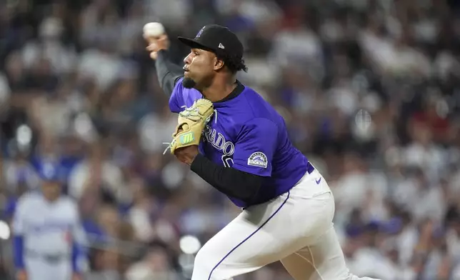 Colorado Rockies relief pitcher Jaden Hill works against the Los Angeles Dodgers in the ninth inning of a baseball game Wednesday, Aug. 20, 2025, in Denver. (AP Photo/David Zalubowski)
