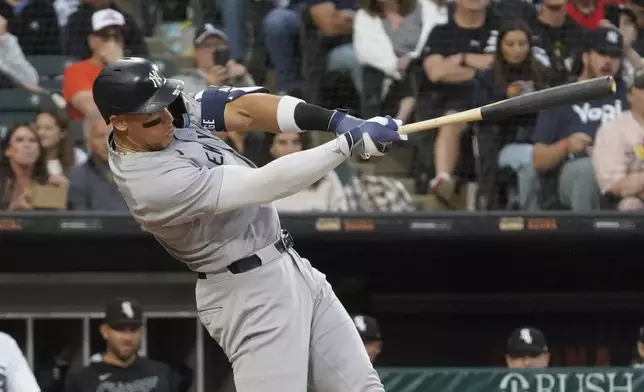 New York Yankees' Aaron Judge hits a home run against the Chicago White Sox during the fourth inning of a baseball game Saturday, Aug. 30, 2025, in Chicago. (AP Photo/David Banks)