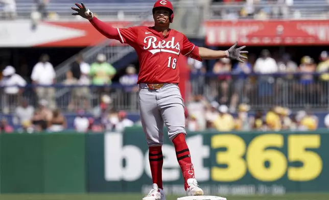 Cincinnati Reds' Noelvi Marte celebrates after hitting an RBI ground rule double during the sixth inning of a baseball game against the Pittsburgh Pirates, Sunday, Aug. 10, 2025, in Pittsburgh. (AP Photo/Matt Freed)