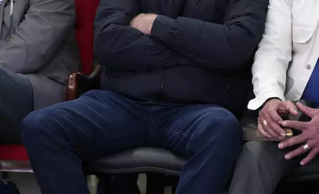 Brazil's former President Jair Bolsonaro, wearing an electronic ankle bracelet on his left ankle, attends a religious service at an evangelical church on the outskirts of Brasilia, Brazil, Thursday, July 24, 2025. (AP Photo/Eraldo Peres)