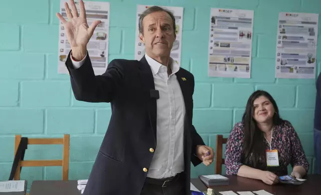Presidential candidate Jorge "Tuto" Quiroga waves before voting in general elections in La Paz, Bolivia, Sunday, Aug. 17, 2025. (AP Photo/Natacha Pisarenko)