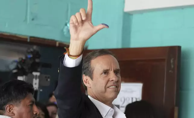 Presidential candidate Jorge "Tuto" Quiroga gestures after voting in general elections in La Paz, Bolivia, Sunday, Aug. 17, 2025. (AP Photo/Natacha Pisarenko)