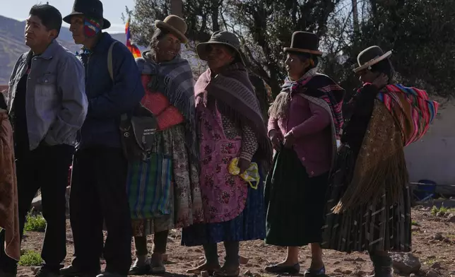 Voters line up at a polling startion during general elections in Jesus de Machaca, Bolivia, Sunday, Aug. 17, 2025. (AP Photo/Juan Karita)