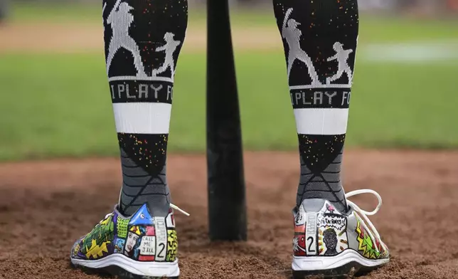 Oakland Athletics' Khris Davis cleats for Players Weekend against the Minnesota Twins during a baseball game Friday, Aug. 24, 2018, in Minneapolis. Davis leads the majors with 39 home runs and ranks second in RBIs with 103 behind Boston's J.D. Martinez. (AP Photo/Andy Clayton-King)